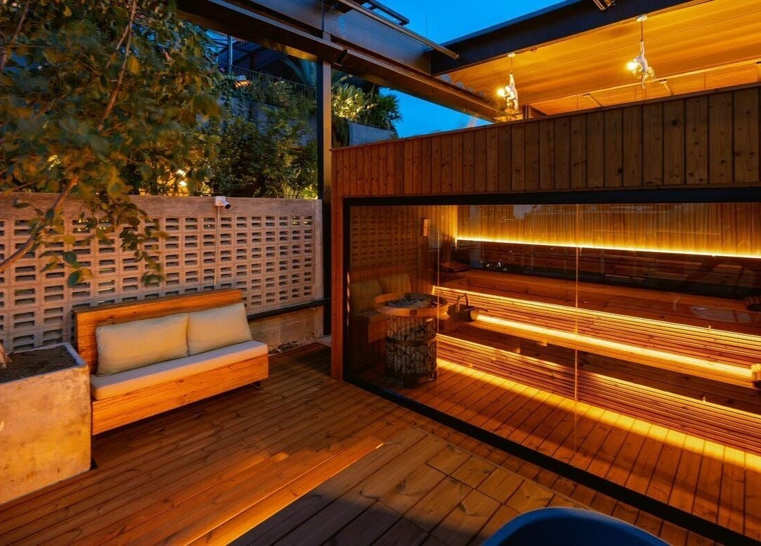Cozy outdoor seating and sauna at Celestino Spa in Medellín, Antioquia, CO.