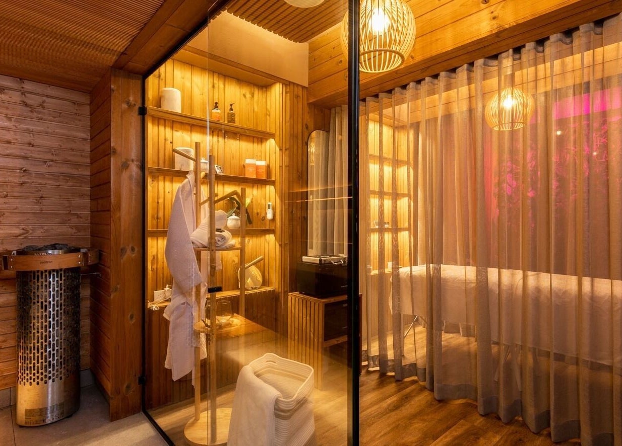 Luxurious wooden sauna room at Celestino Spa, Medellín, Antioquia, CO, offering a serene wellness experience.