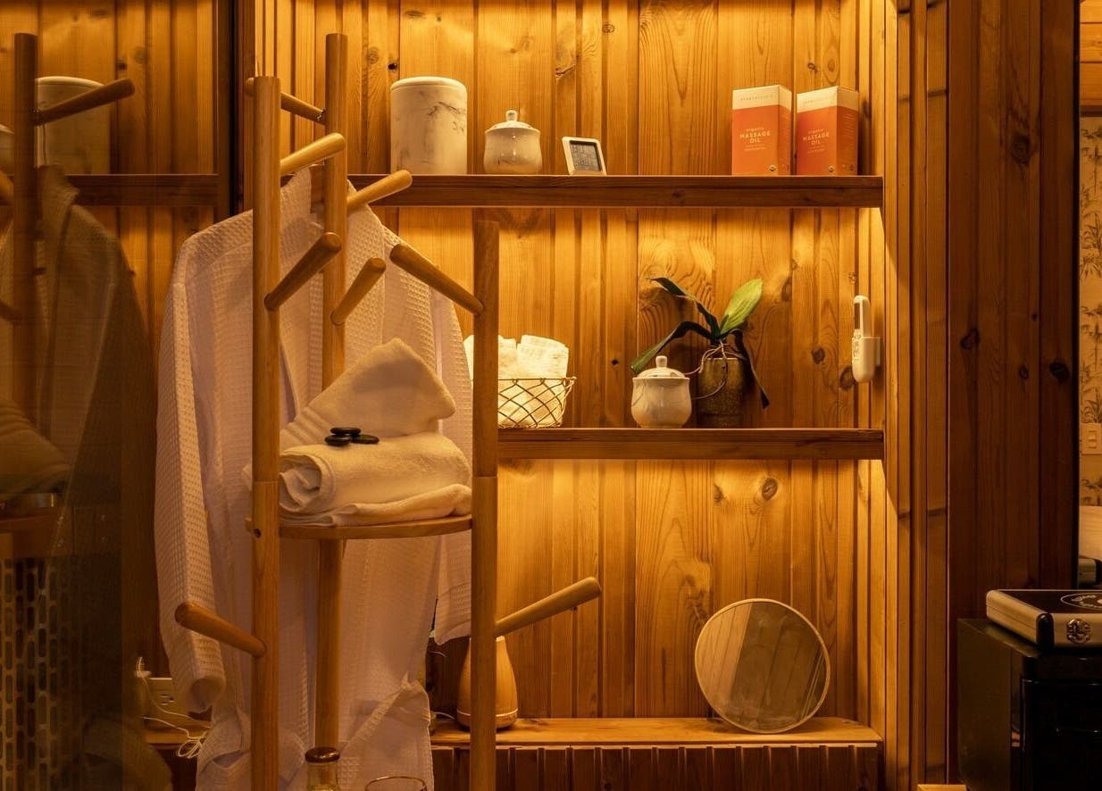 Warm wooden shelves with spa essentials at Celestino Spa, Medellín, Antioquia, CO.