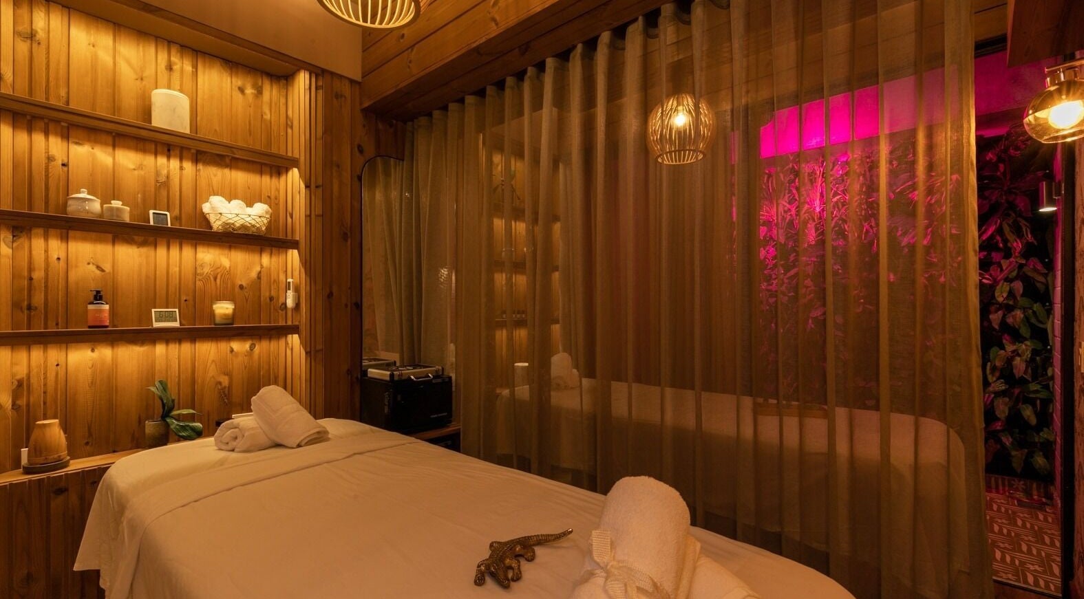 Tranquil treatment room at Celestino Spa, Medellín, Antioquia, CO, featuring soft lighting and cozy ambiance.