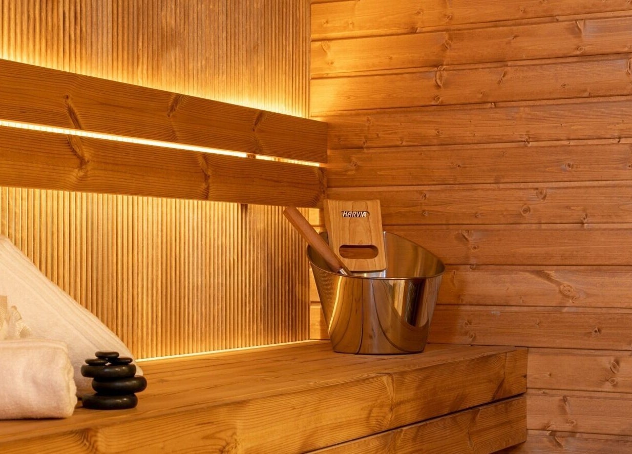 Warm wooden sauna interior at Celestino Spa, Medellín, Antioquia, CO, enhancing relaxation and wellness.