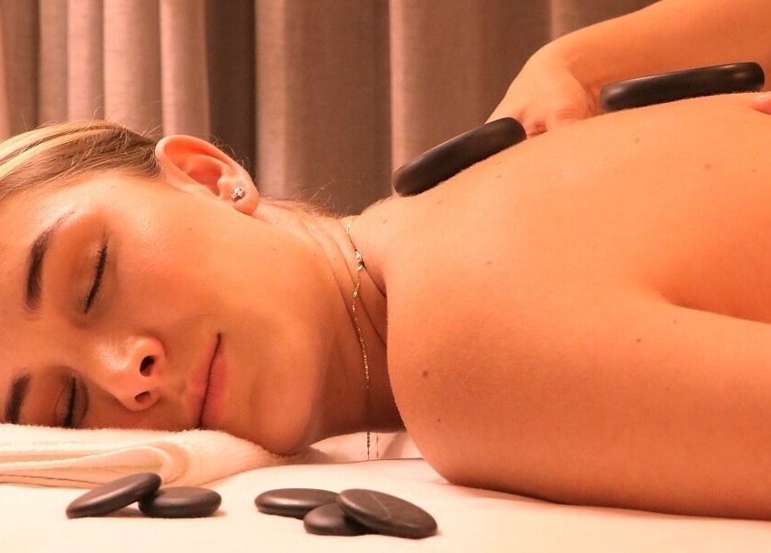 Relaxing hot stone massage at Celestino Spa, Medellín, Antioquia, CO for ultimate relaxation.