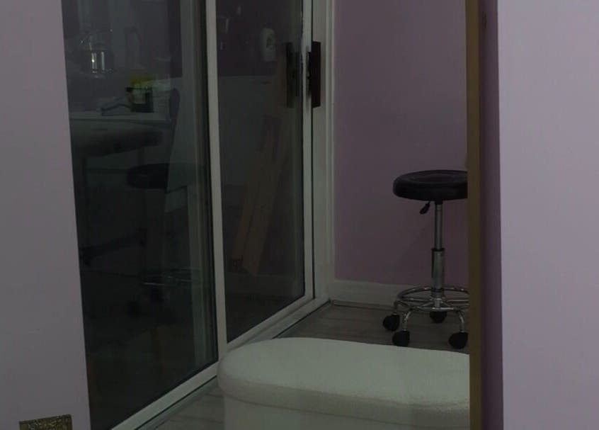 Beauty and the Hair in ENFIELD, England, GB features a tranquil treatment room with modern decor.