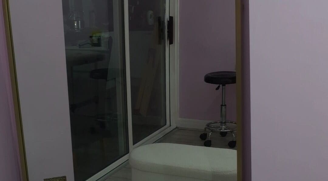 Beauty and the Hair in ENFIELD, England, GB features a tranquil treatment room with modern decor.