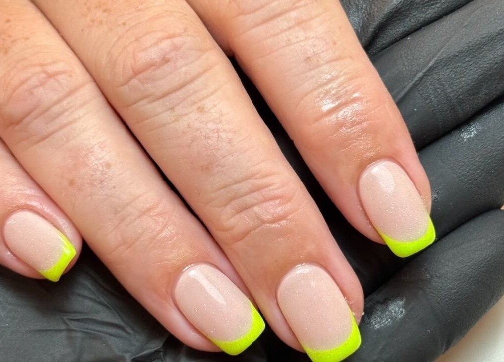 Neon green French manicure at Morgan Sophie Nails in Colchester, England, GB.