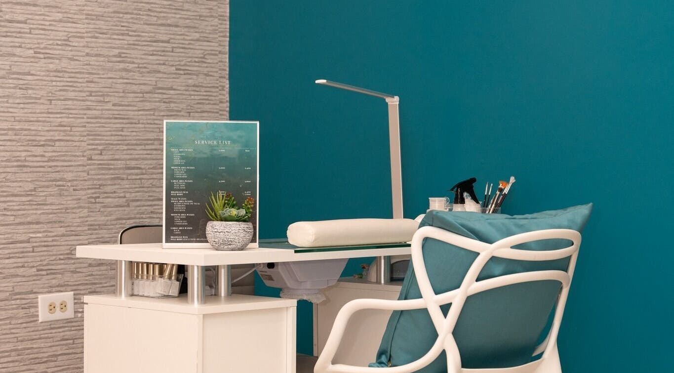 Cozy nail service setup at Spa Blu Mandeville in Mandeville, Manchester Parish, JM with teal decor.