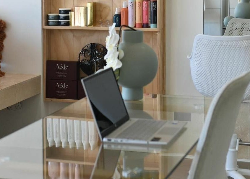 Elegant beauty studio at Lady Lox, Joondalup, Western Australia. Modern decor with laptop on glass desk.