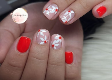 Floral nail art at The Beauty Room, Gqeberha, Eastern Cape, ZA offers vibrant style.