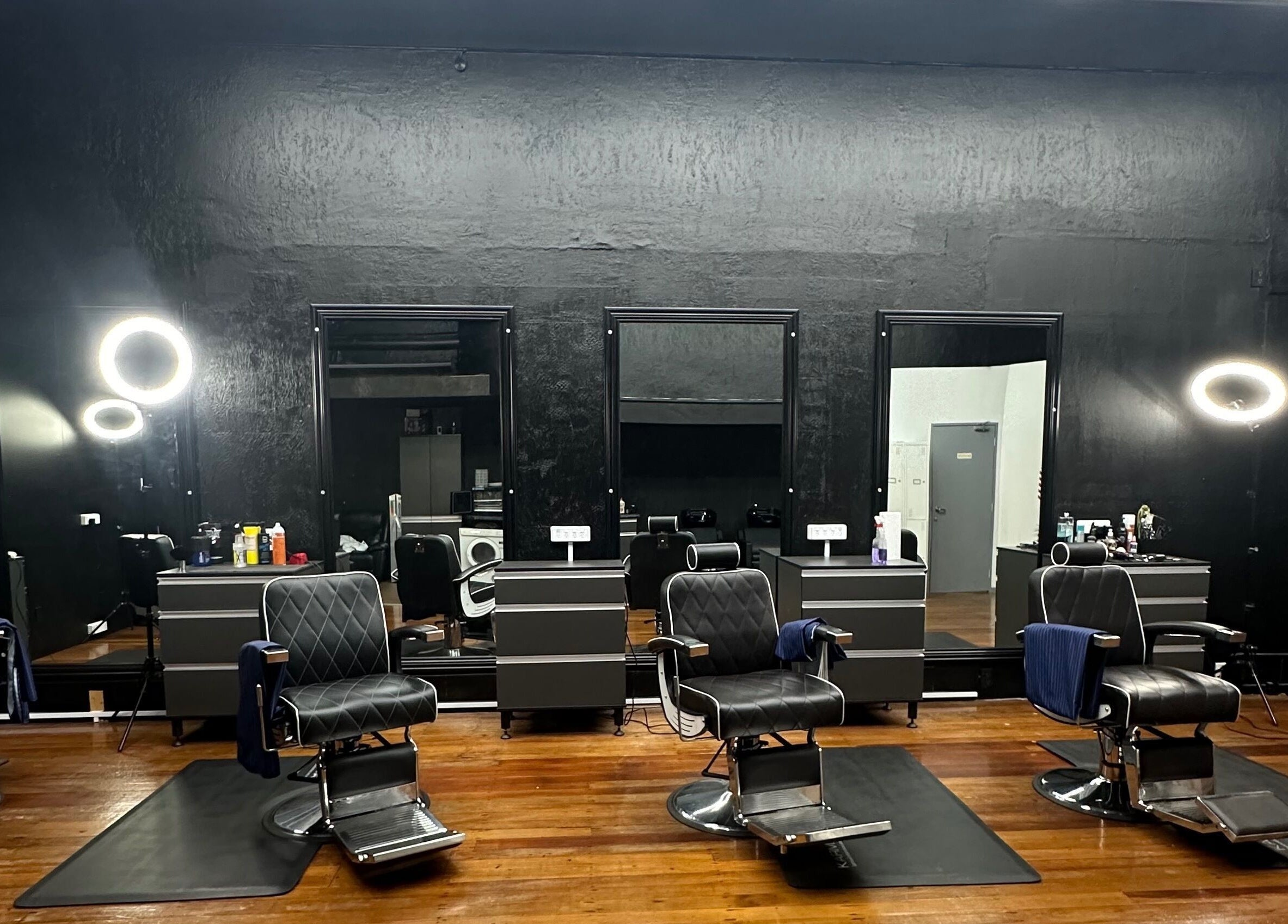 Modern interior of Only Fades Barbershop Inv, Invercargill, Southland, NZ with stylish chairs and mirrors.