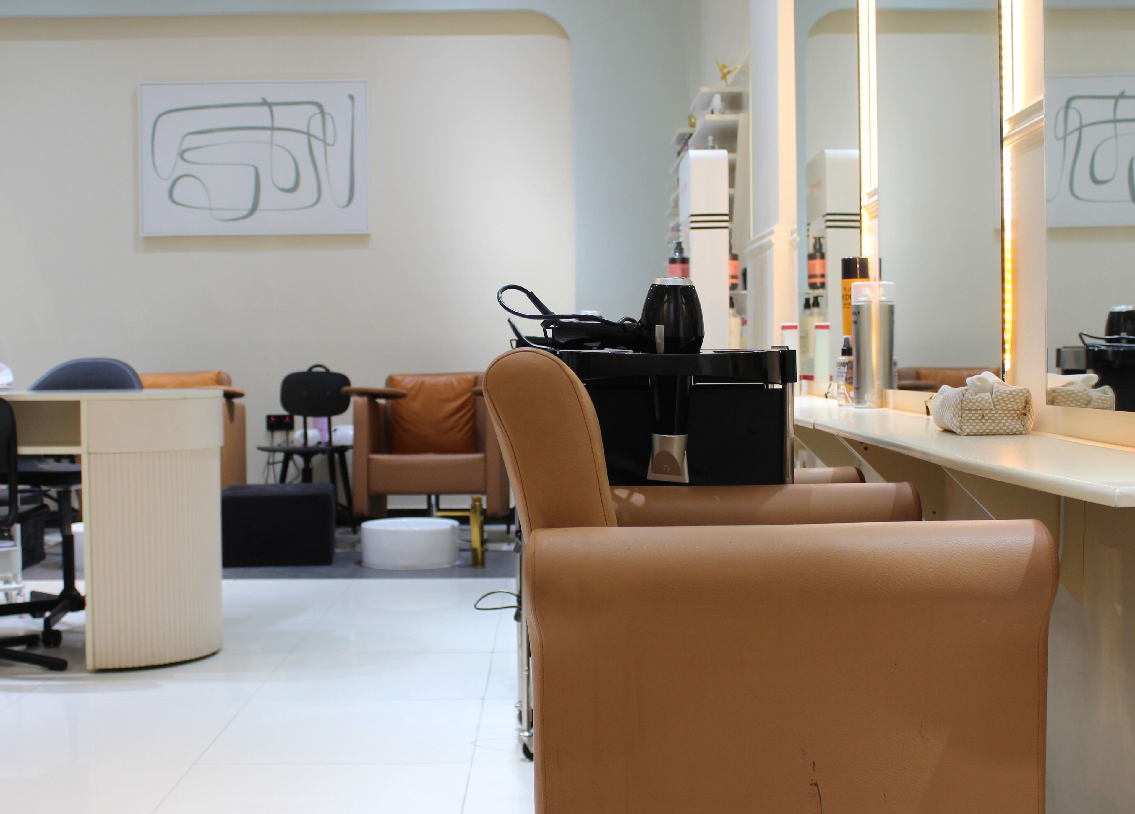 Modern interior of Vivant Beauty Salon in Dubai, Dubai, AE showcasing stylish chairs and bright lighting.