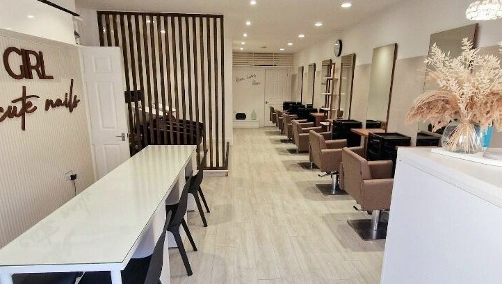 Elegant interior of Tress and Bloom Neath, Neath, Wales, GB, featuring modern chairs and wooden decor.