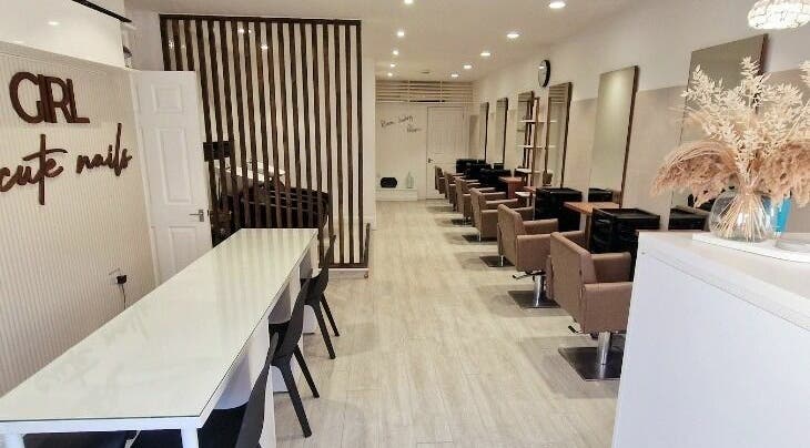 Elegant interior of Tress and Bloom Neath, Neath, Wales, GB, featuring modern chairs and wooden decor.