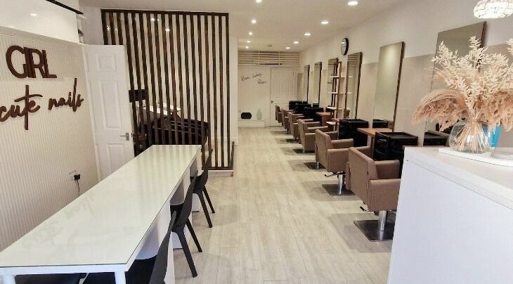 Elegant interior of Tress and Bloom Neath, Neath, Wales, GB, featuring modern chairs and wooden decor.