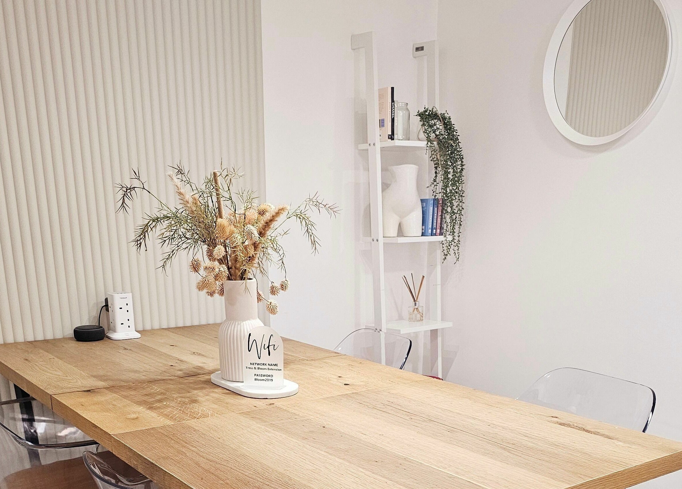 Elegant minimalist decor in Tress and Bloom Neath, Neath, Wales, GB with wooden table and soft lighting.