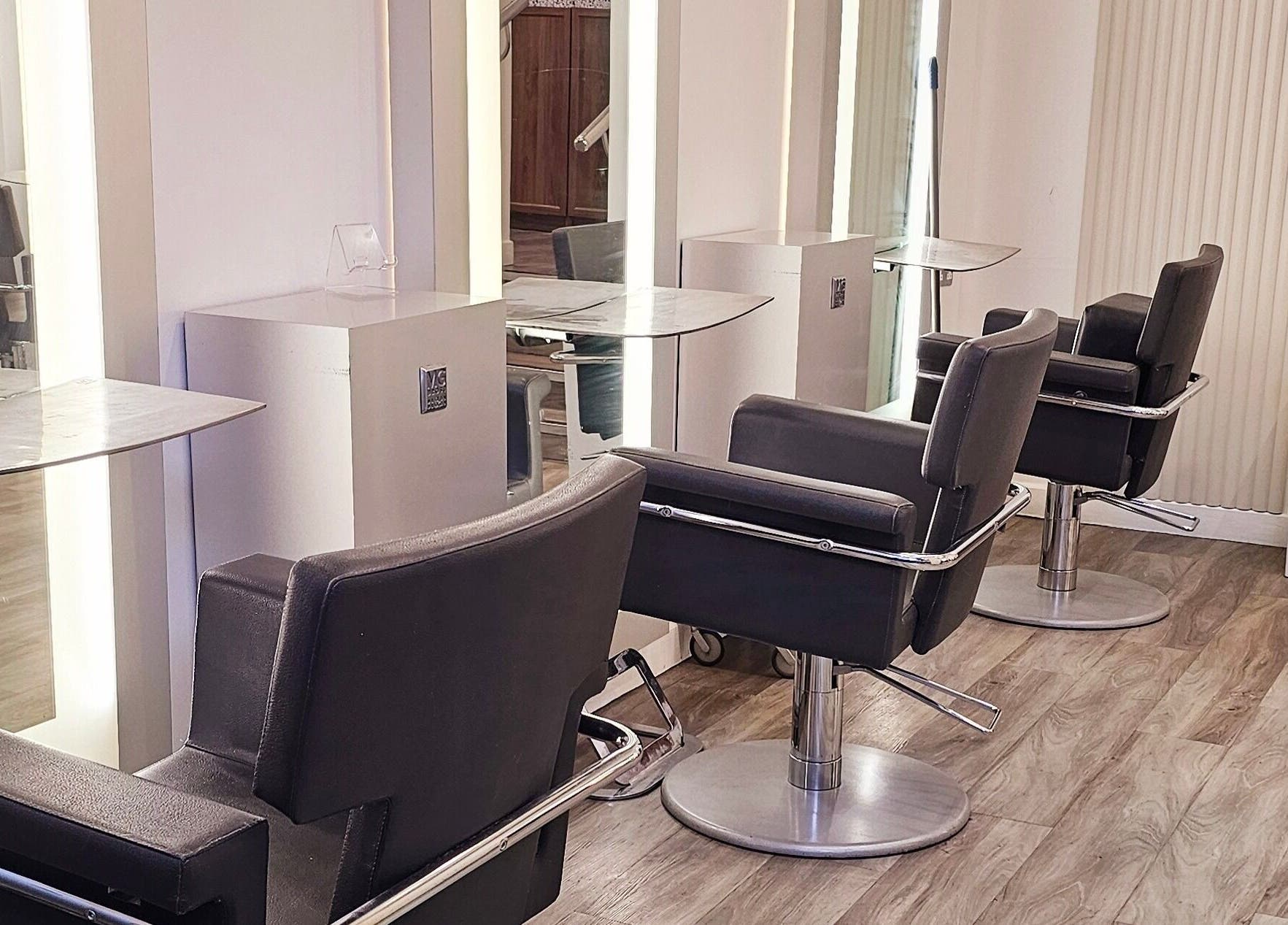 Modern salon chairs at Tress and Bloom Ystradgynlais in Ystradgynlais, Wales, GB, reflecting sleek decor.