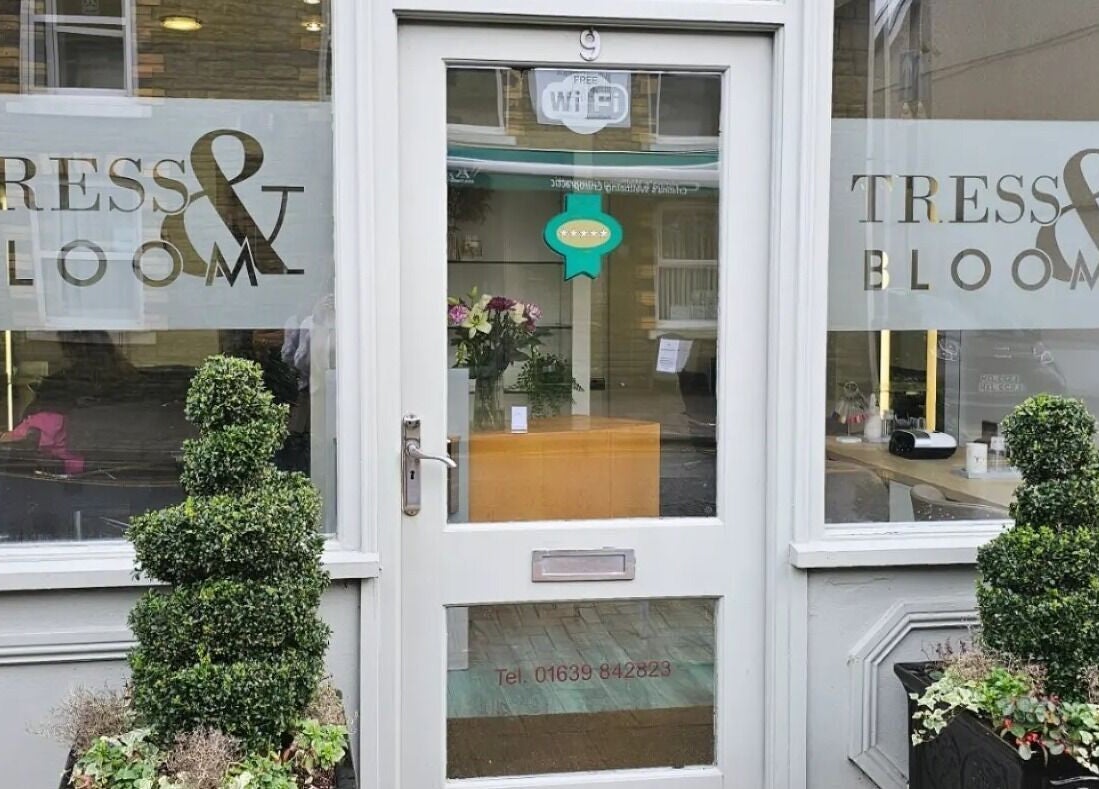 Entrance of Tress and Bloom Ystradgynlais, Ystradgynlais, Wales, GB featuring sleek decor and welcoming vibe.