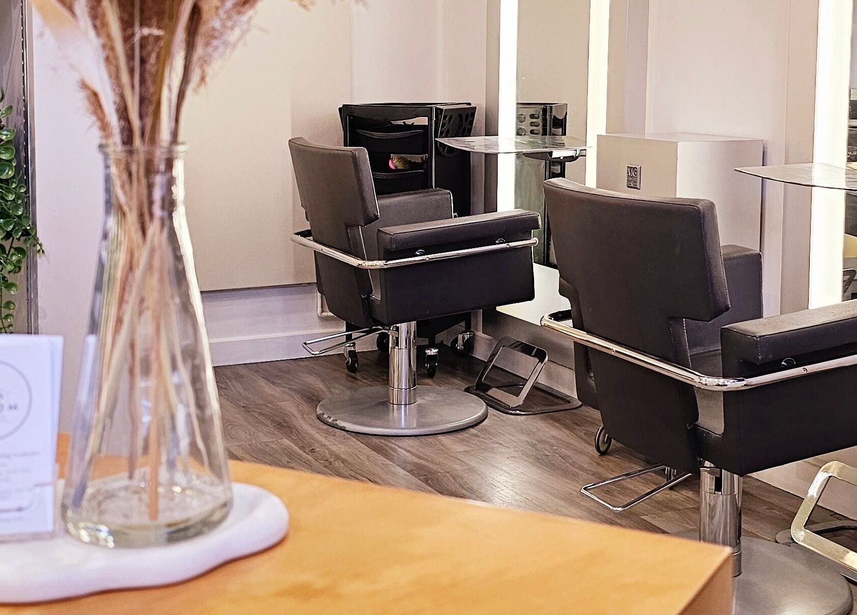 Chic interior of Tress and Bloom Ystradgynlais, Ystradgynlais, Wales, GB, showcasing modern salon chairs.