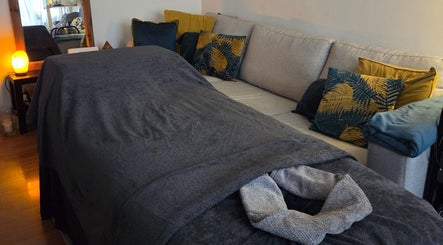 Relaxing massage area with soft blanket and cushions at JemStone Therapy, London, England, GB.