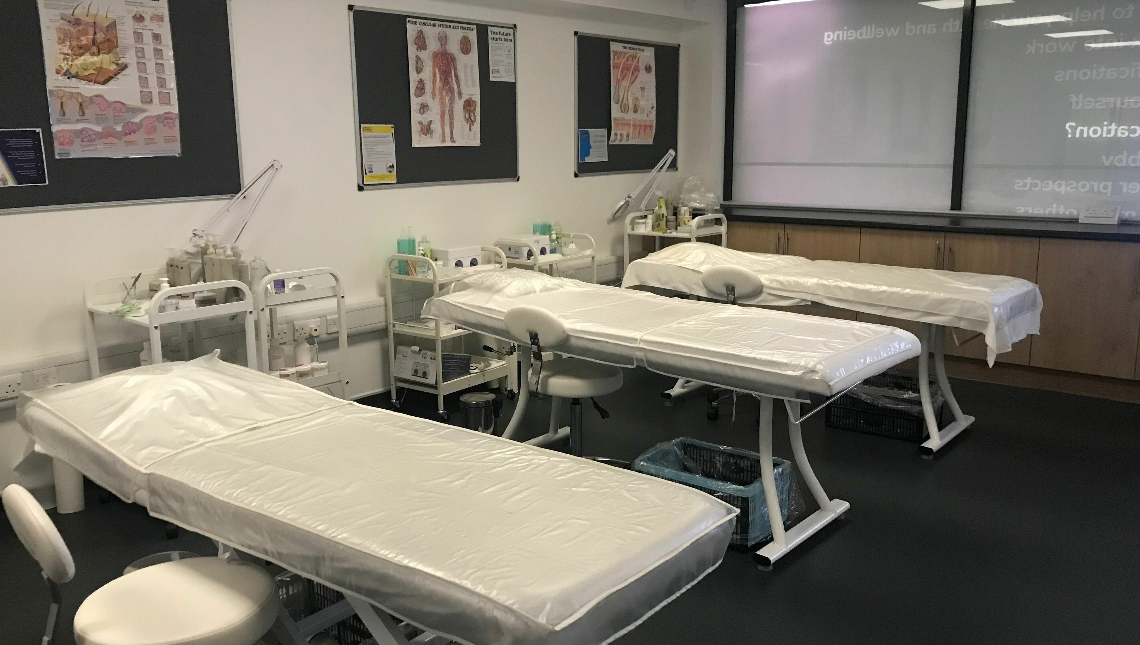 Therapy beds at Skills and Learning Beauty Training Salon, Poole, England, GB, ready for beauty treatments.