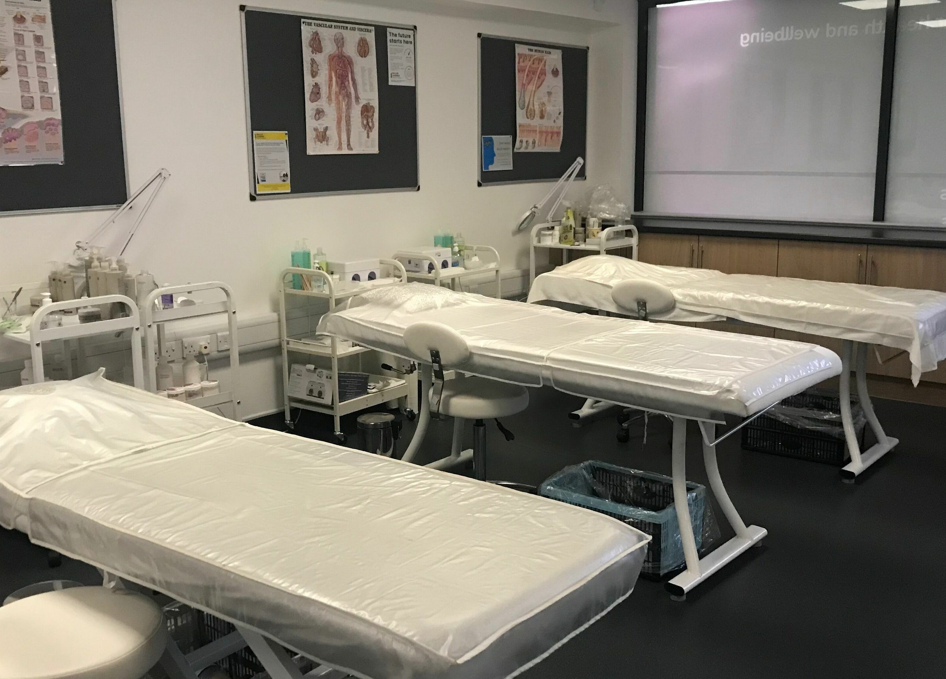 Therapy beds at Skills and Learning Beauty Training Salon, Poole, England, GB, ready for beauty treatments.