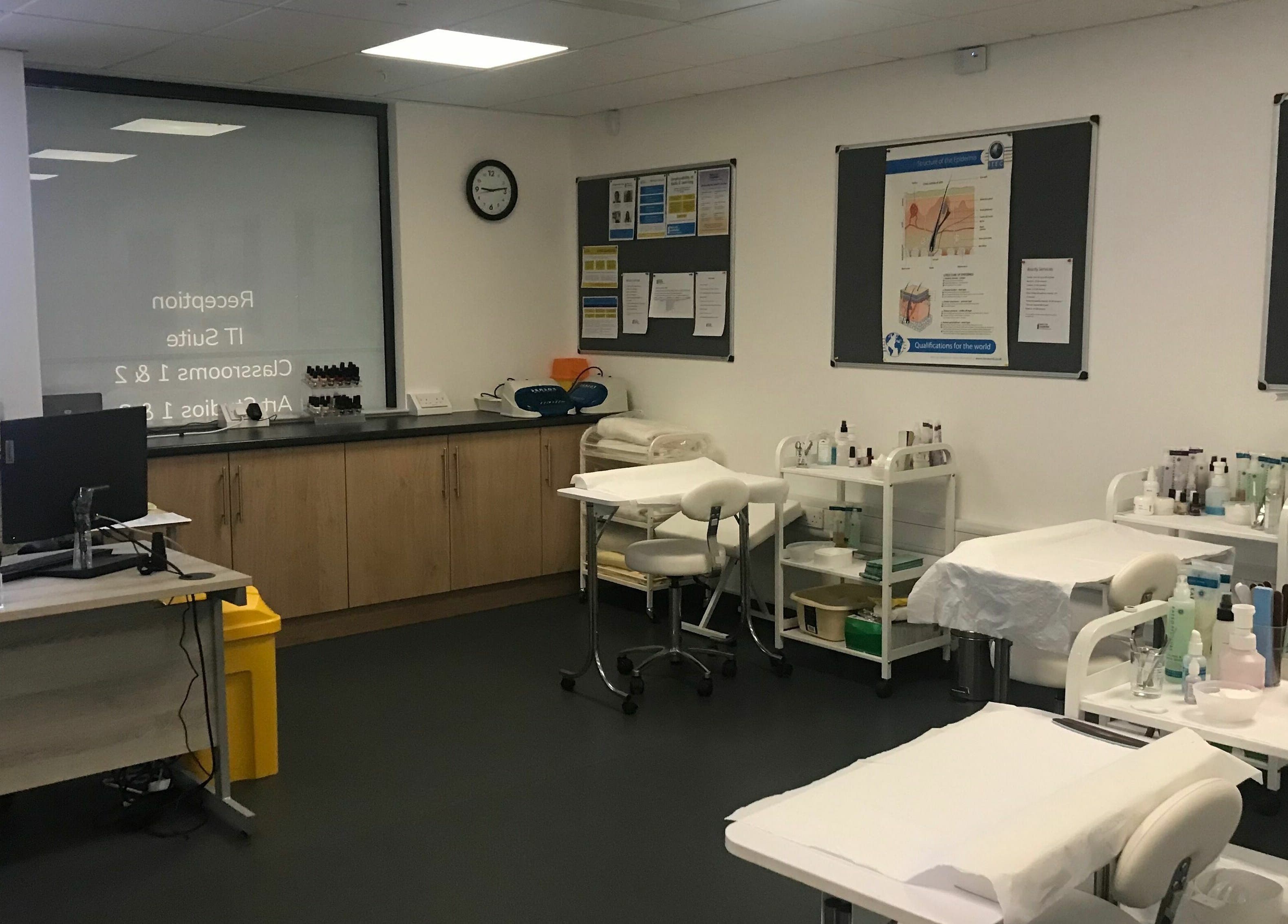 Modern classroom at Skills and Learning Beauty Training Salon, Poole, England, GB, showcasing beauty equipment.