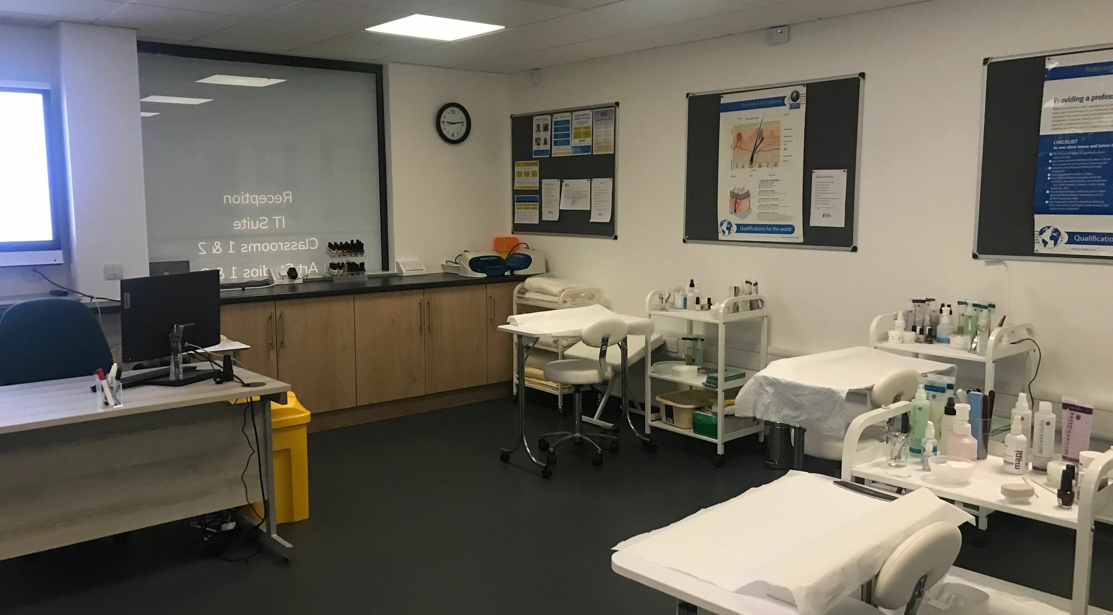 Modern classroom at Skills and Learning Beauty Training Salon, Poole, England, GB, showcasing beauty equipment.