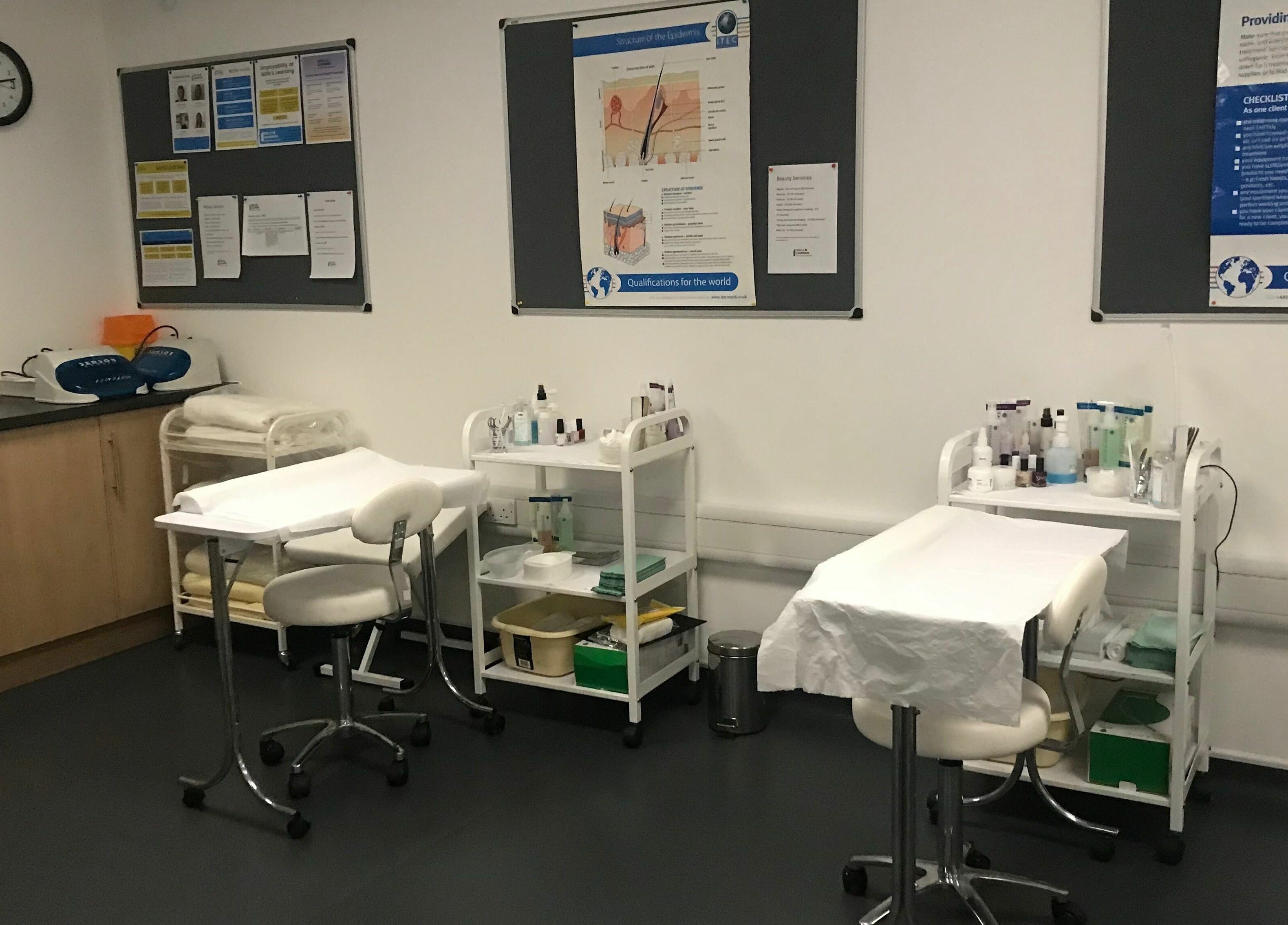 Skills and Learning Beauty Training Salon room setup in Poole, England, GB with treatment tables and supplies.
