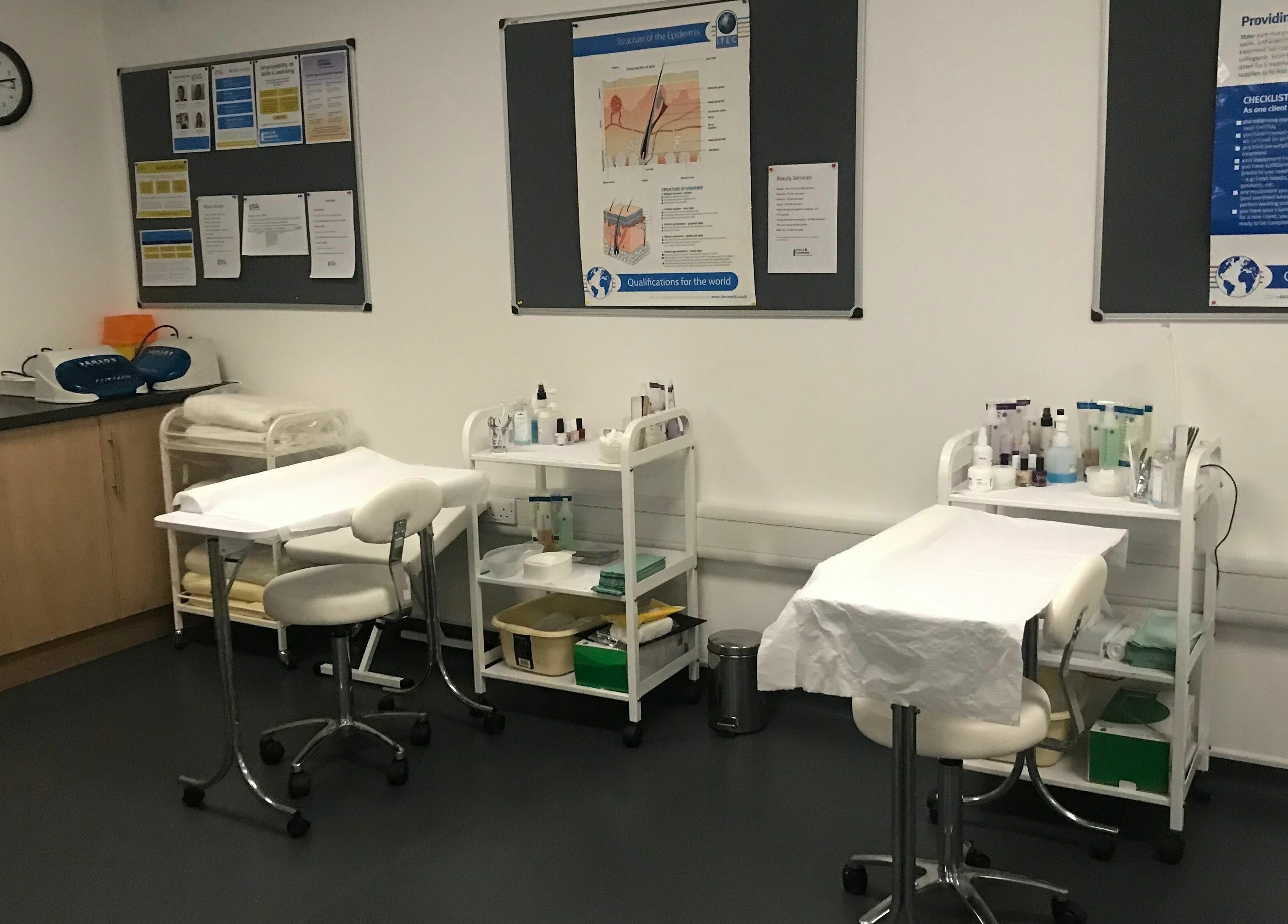 Skills and Learning Beauty Training Salon room setup in Poole, England, GB with treatment tables and supplies.