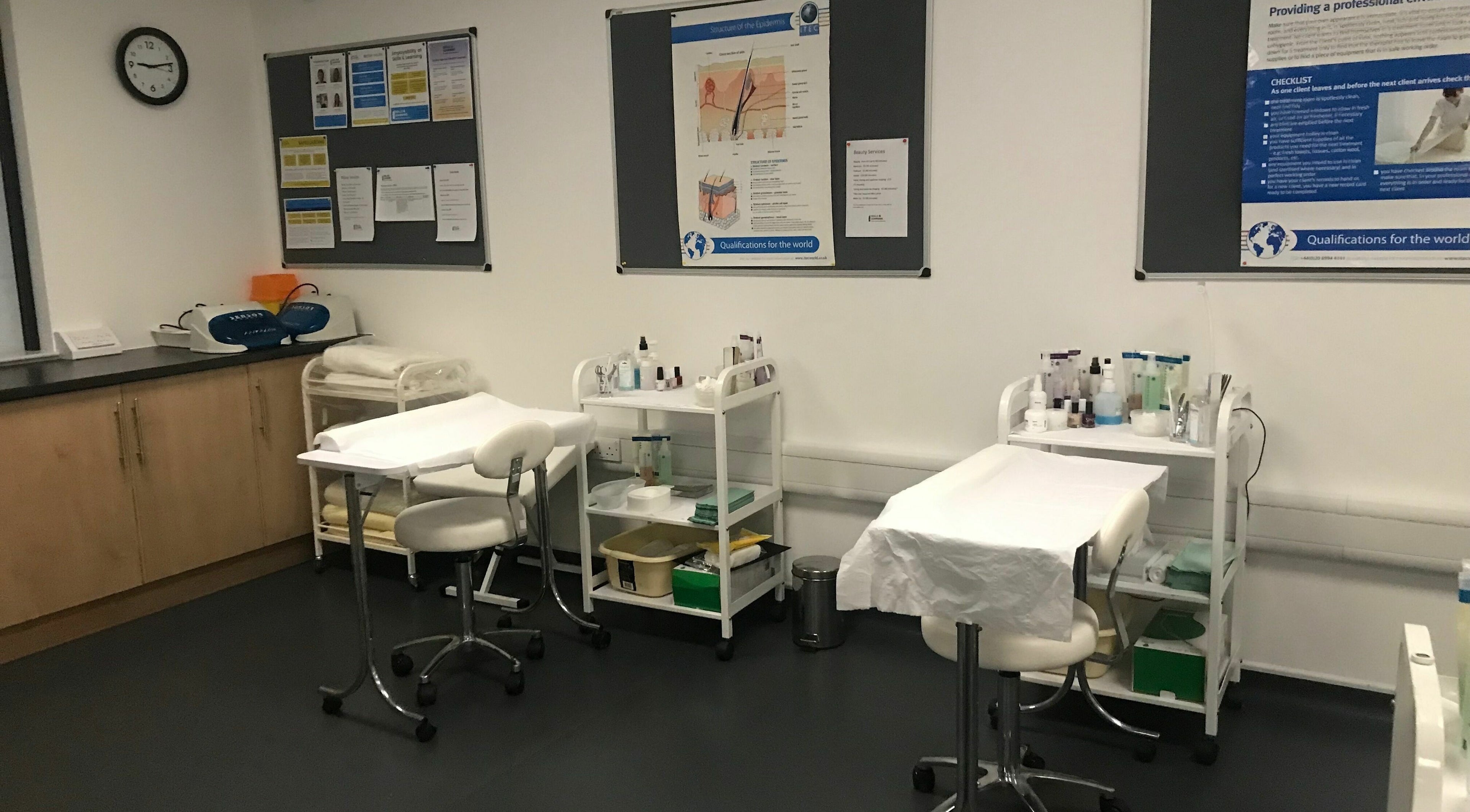 Skills and Learning Beauty Training Salon room setup in Poole, England, GB with treatment tables and supplies.