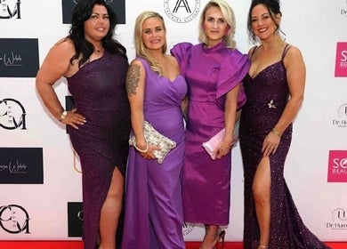 Four women in stylish purple gowns at Fempire Beauty event, Glasgow, Scotland, GB.