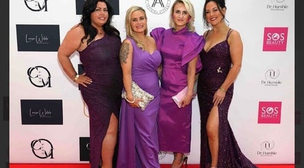 Four women in stylish purple gowns at Fempire Beauty event, Glasgow, Scotland, GB.