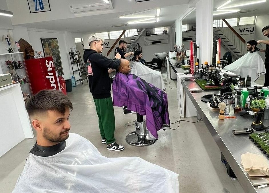 Barbers in action at The House of the Butcher, Limassol, Limassol, CY, providing haircuts in a modern salon.