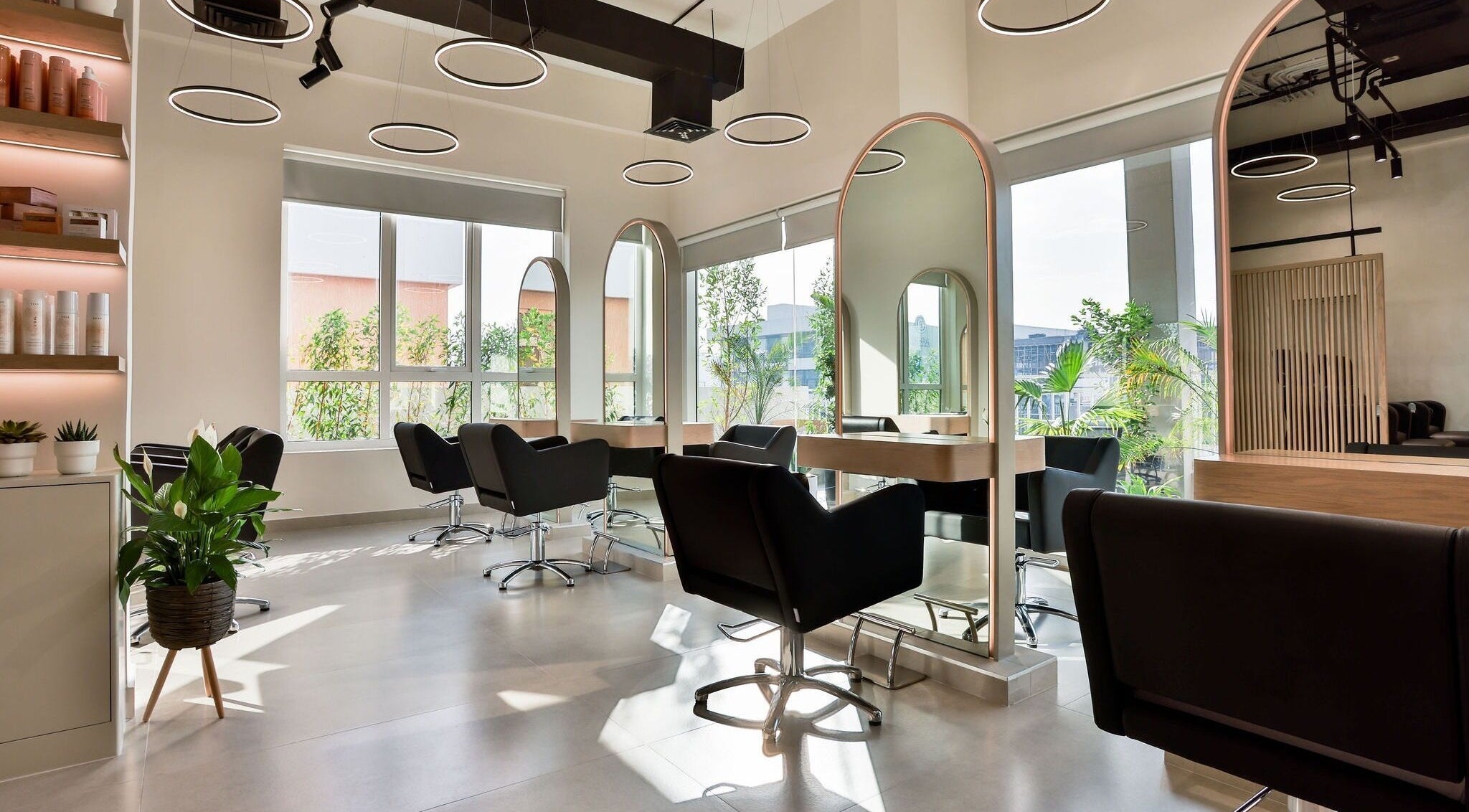 Stylish interior of The Nest Hair Salon, Jumeirah with modern decor and lush greenery, Dubai, AE.
