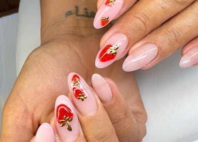 Elegant strawberry nail art at Ballerina Beauty, Leeds, England, GB. Perfect for a stylish manicure.