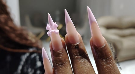 Trendy long stiletto nails with 3D pink bow at Prudeee.Beauty.Studio, Akasia, Gauteng, ZA.