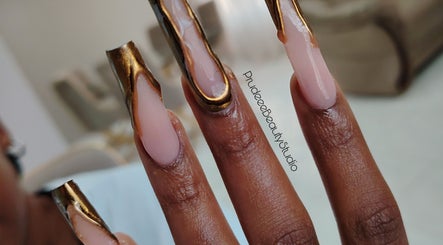 Elegant golden nail art by Prudeee.Beauty.Studio in Akasia, Gauteng, ZA, showcasing fine detail and creativity.