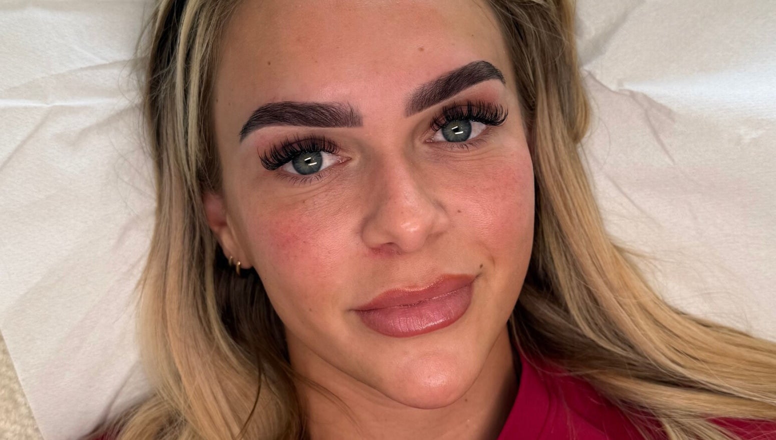 Client with enhanced eyebrows and lashes at Making Beauty, Maldon, England, GB.