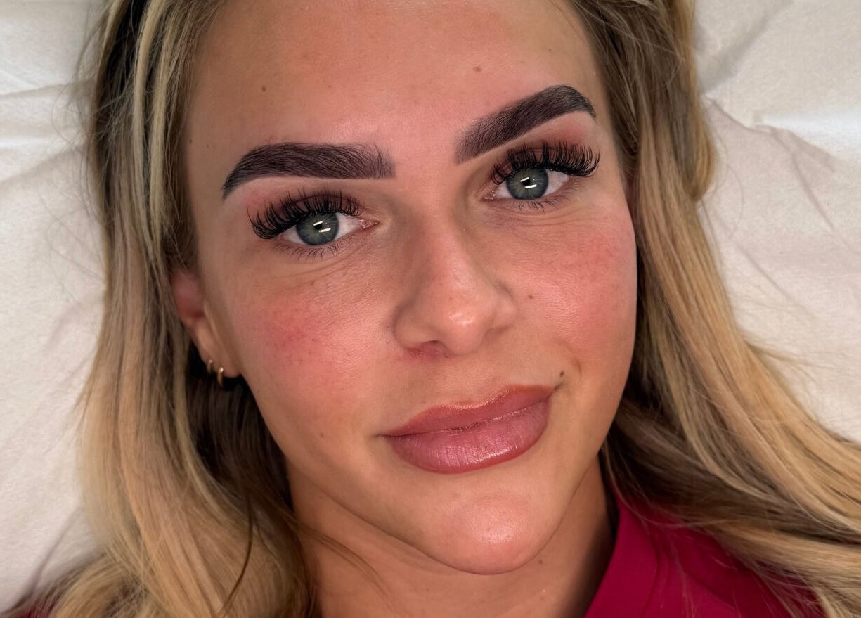 Client with enhanced eyebrows and lashes at Making Beauty, Maldon, England, GB.