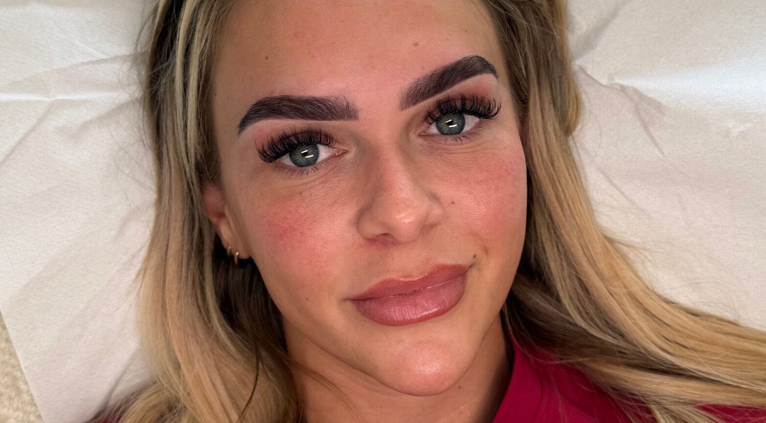 Client with enhanced eyebrows and lashes at Making Beauty, Maldon, England, GB.