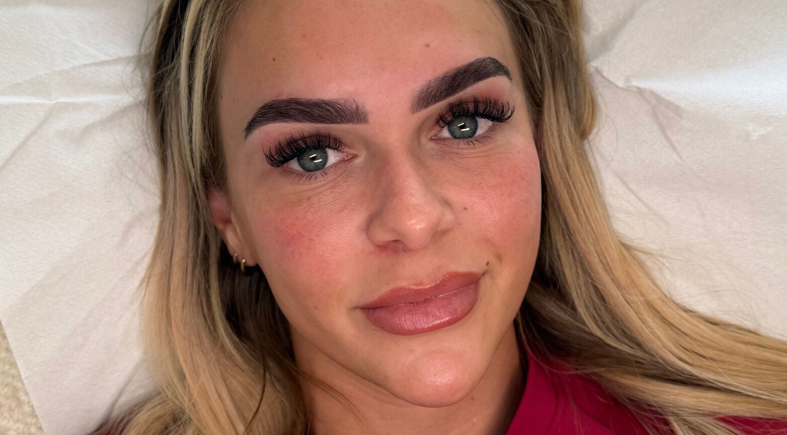 Client with enhanced eyebrows and lashes at Making Beauty, Maldon, England, GB.