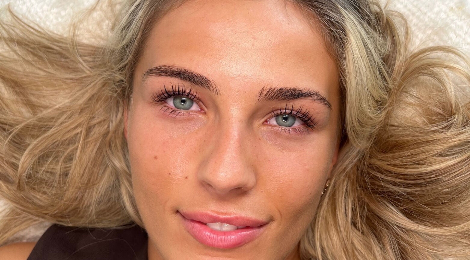 Close-up of a woman with radiant skin at Making Beauty, Maldon, England, GB.