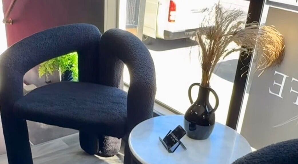 Modern seating at Aio Skin (Friday Glow), Kawakawa, Northland, NZ with plush chairs and sleek décor.