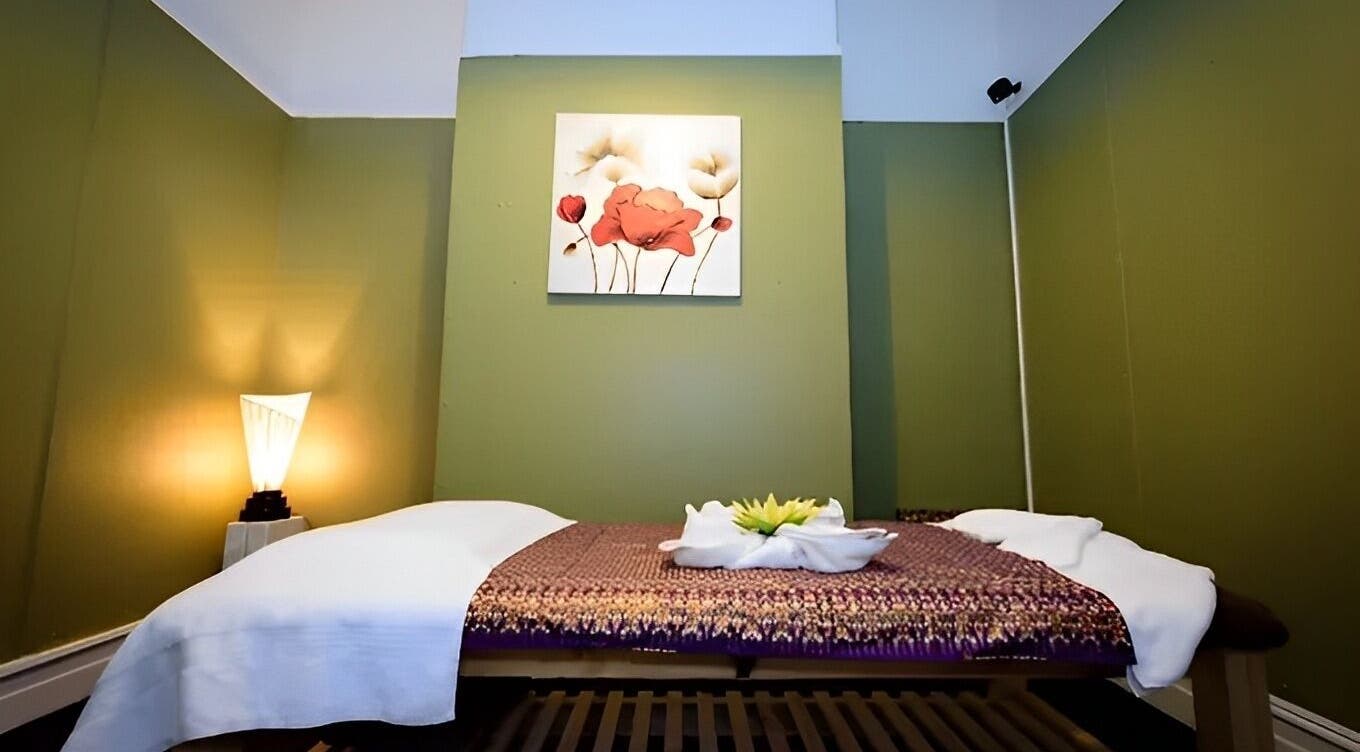 Relaxing massage room at Nina Thai & Remedial Massage, Melbourne, Victoria, AU with cozy green decor.