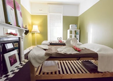 Relaxing massage room at Nina Thai & Remedial Massage, Melbourne, Victoria, AU, featuring serene decor and soft lighting.