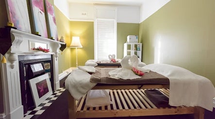 Relaxing massage room at Nina Thai & Remedial Massage, Melbourne, Victoria, AU, featuring serene decor and soft lighting.