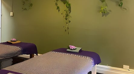 Serene massage room at Nina Thai & Remedial Massage, Melbourne, Victoria, AU with calming decor and twin beds.