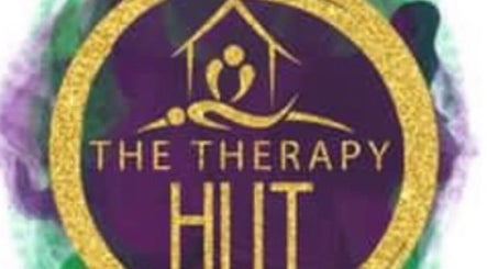 Logo of The Therapy Hut in Bishopton, Scotland, GB, featuring a golden design on a purple backdrop.
