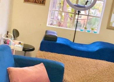 Chichimakeupandlashes beauty corner in Johannesburg, Gauteng, ZA featuring plush blue seating.