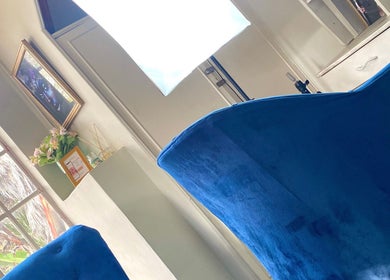 Elegant blue velvet chairs at Chichimakeupandlashes, Johannesburg, Gauteng, ZA, offering a serene atmosphere.