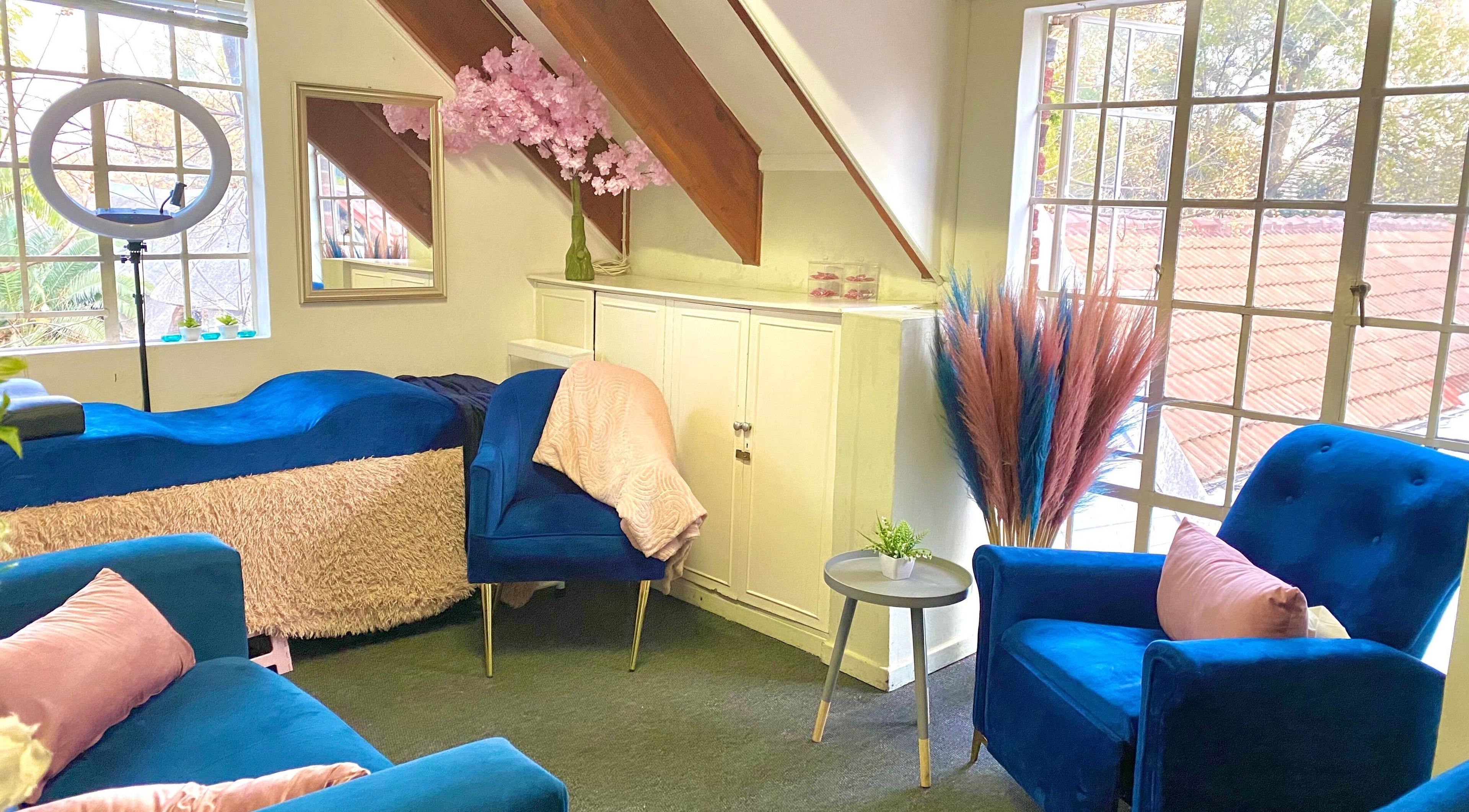 Cozy salon interior with blue chairs at GlossandGrace_BeautyAtelier, Johannesburg, Gauteng, ZA.